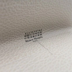 Maison Margiela Fold Over Snap Wallet In Greige | Stylish Kids' Accessory 7 Maison Margiela Fold Over Snap Wallet In Greige | Stylish Kids' Accessory -Hervia Shop hervia.com maison margiela sa3tt0003 p4455 t2003 fold over snap wallet 1652704995SA3TT0003 5